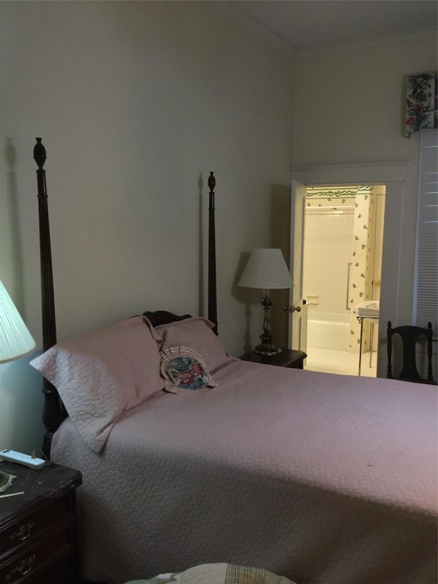 1014 N Sycamore St, Palestine, TX 75801 - bedroom with crown molding and ensuite bathroom