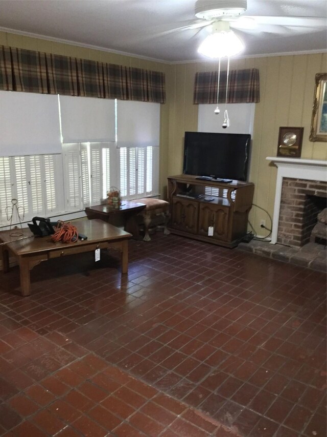1014 N Sycamore St, Palestine, TX 75801 - living area featuring ceiling fan, crown molding, and a fireplace