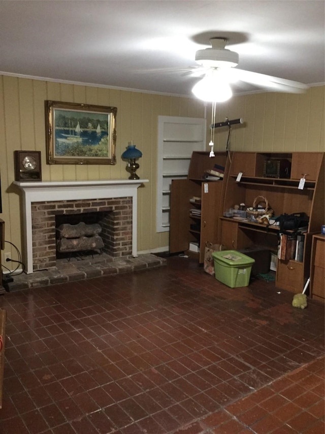 1014 N Sycamore St, Palestine, TX 75801 - living room with ceiling fan, a brick fireplace, and crown molding