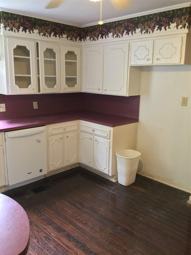 1014 N Sycamore St, Palestine, TX 75801 - kitchen featuring dishwasher, dark wood finished floors, white cabinetry, and dark countertops