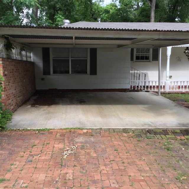 1014 N Sycamore St, Palestine, TX 75801 - view of front of home with metal roof and a carport