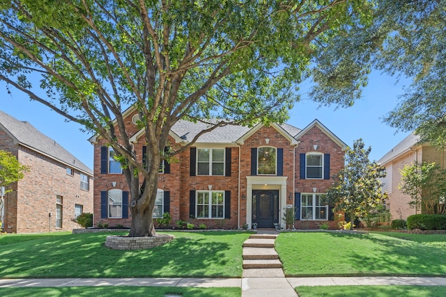 8608 Lancome Dr, Plano, TX 75025 - view of front of house featuring brick siding and a front lawn