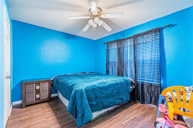 8110 Macgregor Dr, Arlington, TX 76002 - bedroom with wood finished floors, a textured ceiling, and ceiling fan