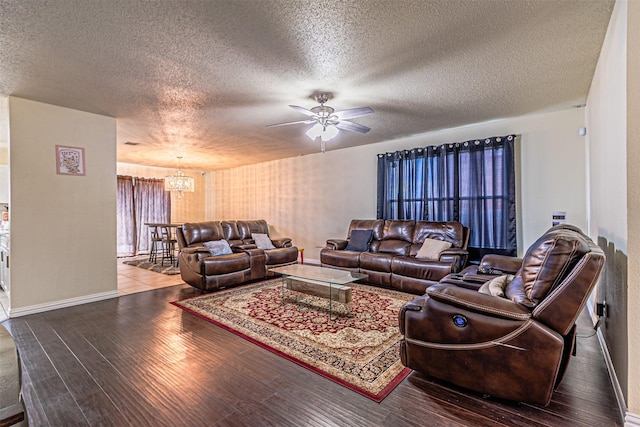 8110 Macgregor Dr, Arlington, TX 76002 - living area with a chandelier, a textured ceiling, baseboards, wood finished floors, and ceiling fan