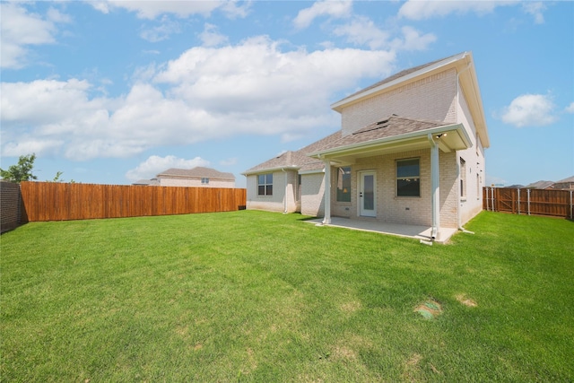 2301 Miramar Dr, Little Elm, TX 75068 - rear view of property featuring brick siding, a patio, and a shingled roof