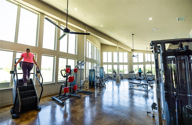 2301 Miramar Dr, Little Elm, TX 75068 - workout area with a ceiling fan, healthy amount of natural light, recessed lighting, baseboards, and a towering ceiling