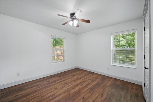 930 Baker St, Denison, TX 75020 - unfurnished room with dark wood-style flooring, baseboards, and ceiling fan