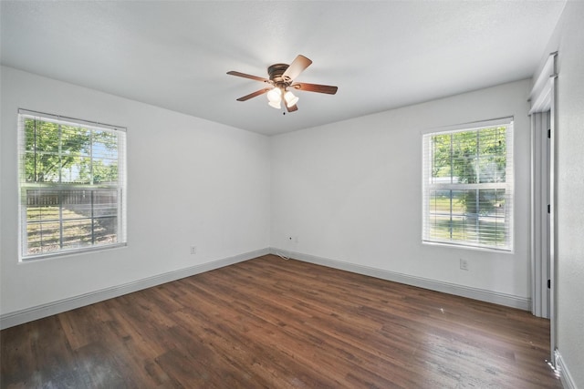 930 Baker St, Denison, TX 75020 - empty room featuring dark wood-style floors, ceiling fan, and baseboards