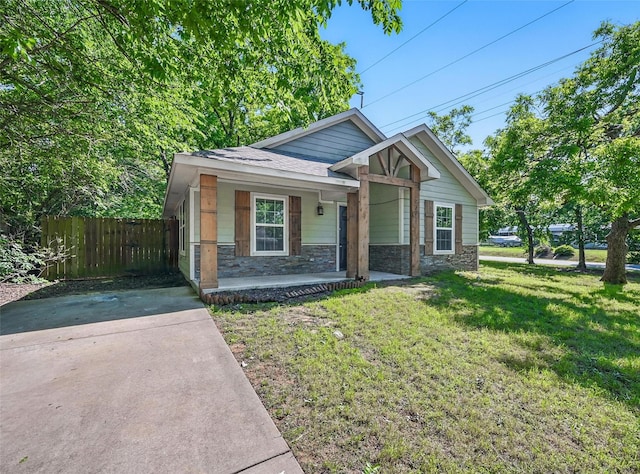 930 Baker St, Denison, TX 75020 - view of front of house featuring stone siding and covered porch