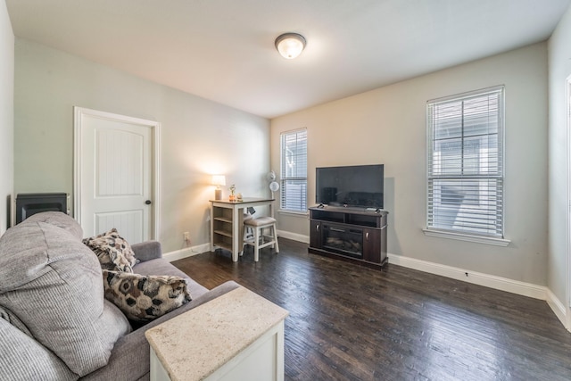 1005 Caudle Ln, Savannah, TX 76227 - living area featuring dark wood-style floors and baseboards