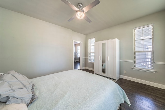 1005 Caudle Ln, Savannah, TX 76227 - bedroom with baseboards, dark wood finished floors, and a ceiling fan