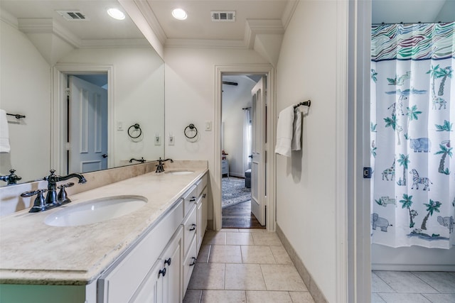 full bathroom with ornamental molding, double vanity, baseboards, shower / bathtub combination with curtain, and tile patterned flooring