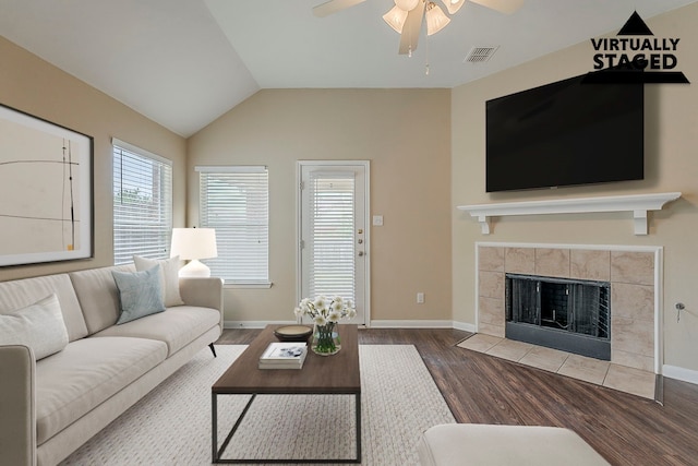 12113 Tacoma Ridge Dr, Fort Worth, TX 76244 - living area featuring ceiling fan, wood finished floors, a fireplace, baseboards, and lofted ceiling