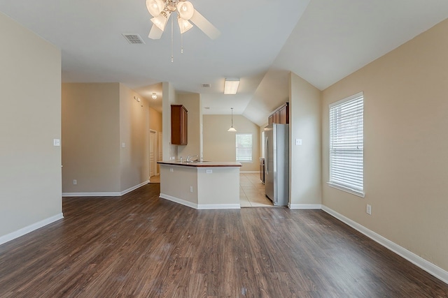 12113 Tacoma Ridge Dr, Fort Worth, TX 76244 - kitchen featuring freestanding refrigerator, open floor plan, dark wood-type flooring, a ceiling fan, and lofted ceiling