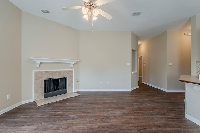 12113 Tacoma Ridge Dr, Fort Worth, TX 76244 - unfurnished living room with a ceiling fan, wood finished floors, baseboards, and a tiled fireplace