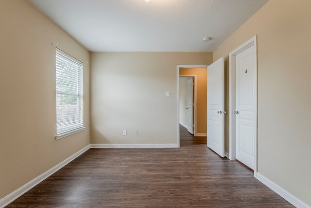 12113 Tacoma Ridge Dr, Fort Worth, TX 76244 - spare room featuring dark wood-type flooring, baseboards, and a smoke detector