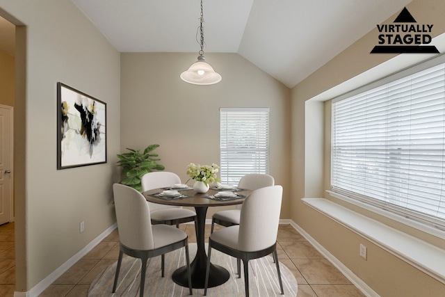 12113 Tacoma Ridge Dr, Fort Worth, TX 76244 - dining room featuring light tile patterned flooring, vaulted ceiling, and baseboards