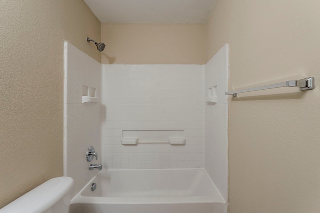 12113 Tacoma Ridge Dr, Fort Worth, TX 76244 - bathroom featuring toilet, shower / washtub combination, and a textured wall