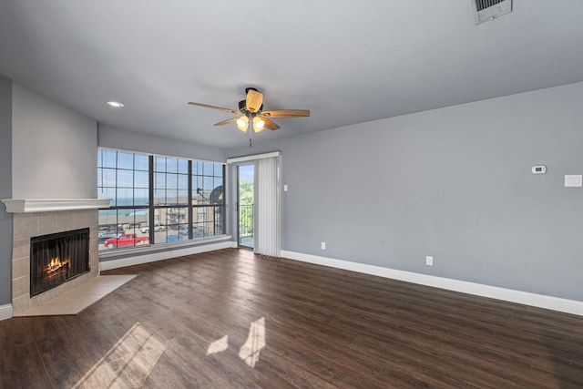 154 Henry M Chandler Dr, Rockwall, TX 75032 - unfurnished living room featuring baseboards, ceiling fan, wood finished floors, a fireplace, and recessed lighting
