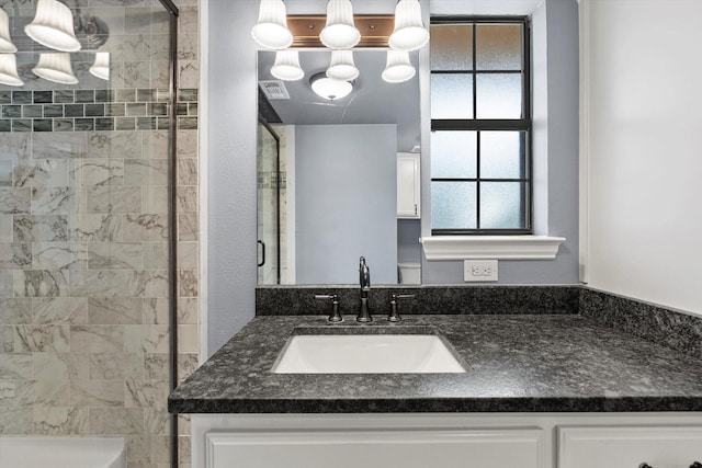 154 Henry M Chandler Dr, Rockwall, TX 75032 - bathroom with a shower stall and vanity