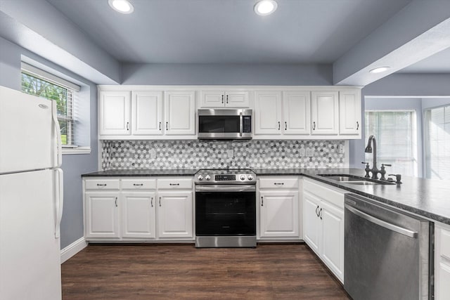 154 Henry M Chandler Dr, Rockwall, TX 75032 - kitchen featuring stainless steel appliances, a sink, recessed lighting, tasteful backsplash, and white cabinets