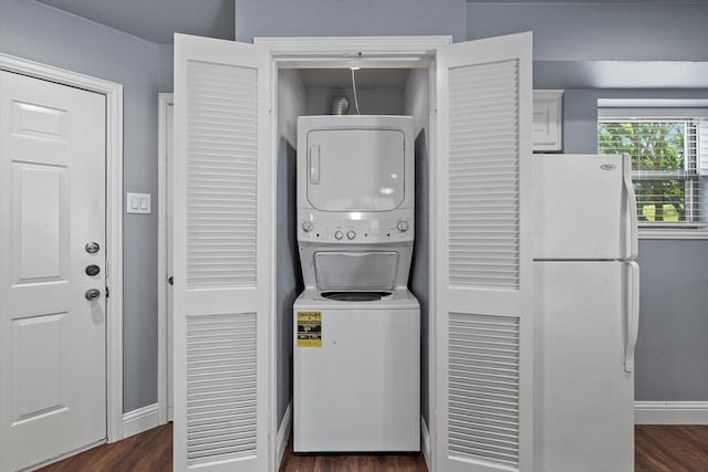 154 Henry M Chandler Dr, Rockwall, TX 75032 - washroom featuring stacked washer and clothes dryer, dark wood-type flooring, and baseboards