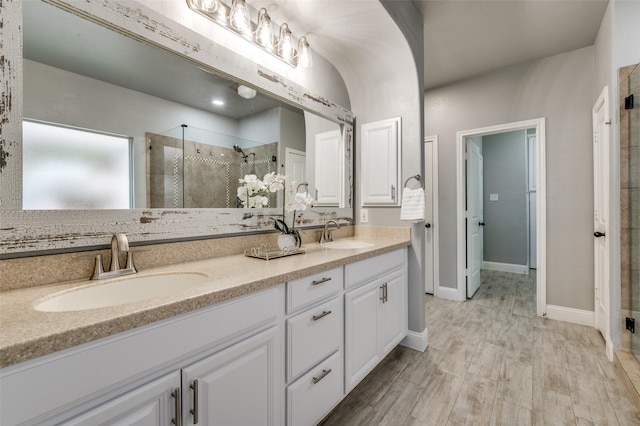 1912 Sunny Side Dr, Little Elm, TX 75068 - full bath with a stall shower, double vanity, and baseboards