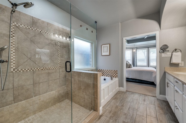 1912 Sunny Side Dr, Little Elm, TX 75068 - ensuite bathroom with a stall shower, vanity, a bath, and wood tiled floors