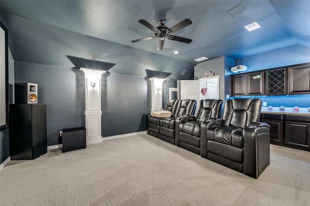 1912 Sunny Side Dr, Little Elm, TX 75068 - cinema room featuring ornate columns, vaulted ceiling, light carpet, a ceiling fan, and baseboards