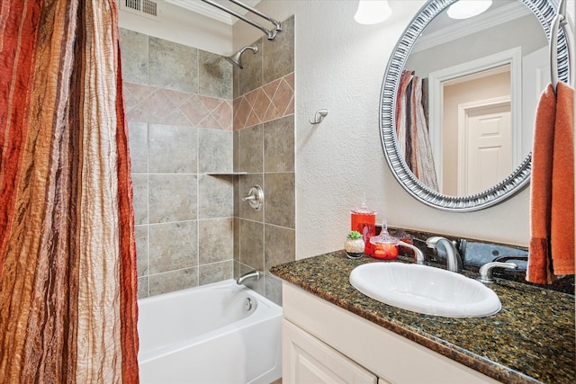4322 Glenaire Dr, Dallas, TX 75229 - bathroom featuring shower / bath combo with shower curtain, vanity, a textured wall, and ornamental molding