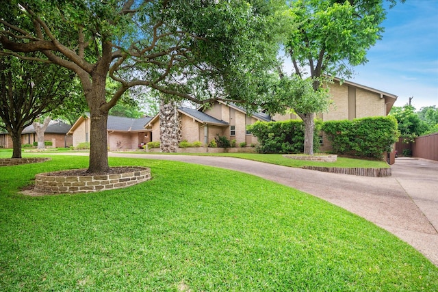 4322 Glenaire Dr, Dallas, TX 75229 - view of front of property with curved driveway and stucco siding