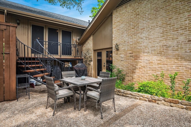 4322 Glenaire Dr, Dallas, TX 75229 - view of patio with outdoor dining area, stairway, and a grill