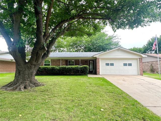 922 S Valentine Dr, Sherman, TX 75090 - ranch-style home with an attached garage, brick siding, concrete driveway, and a front lawn