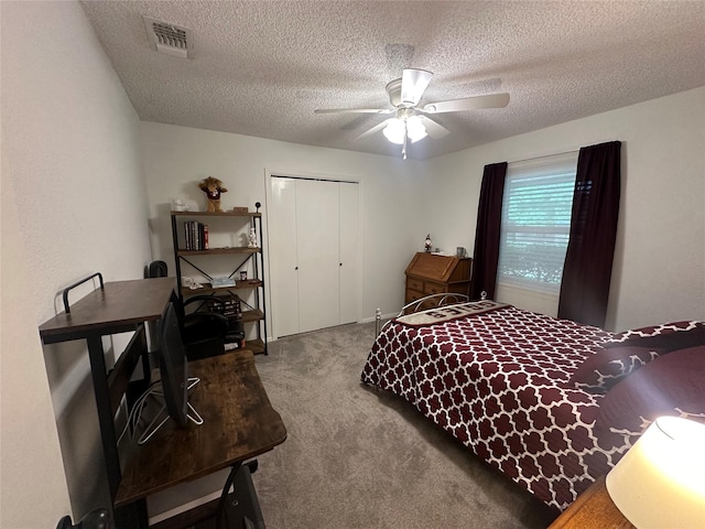 922 S Valentine Dr, Sherman, TX 75090 - carpeted bedroom featuring a closet, a textured ceiling, and a ceiling fan
