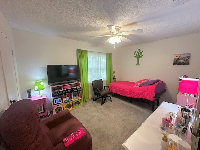 922 S Valentine Dr, Sherman, TX 75090 - bedroom with carpet floors, a ceiling fan, and a textured ceiling