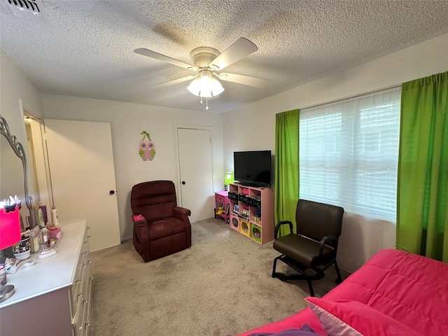 922 S Valentine Dr, Sherman, TX 75090 - bedroom with light carpet, a ceiling fan, and a textured ceiling