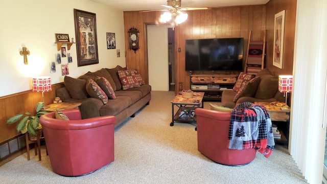 922 S Valentine Dr, Sherman, TX 75090 - living room featuring wooden walls, ceiling fan, and carpet flooring