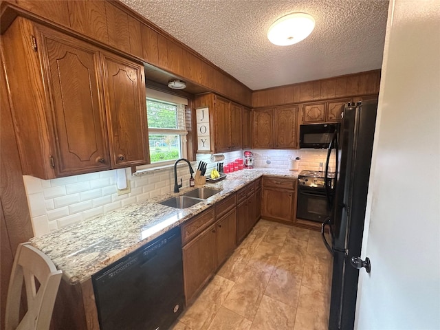 922 S Valentine Dr, Sherman, TX 75090 - kitchen with black appliances, a sink, backsplash, a textured ceiling, and brown cabinetry