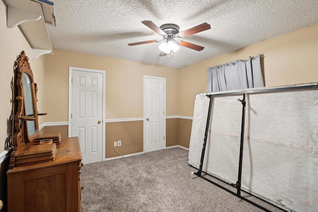 7108 Stonybrooke Dr, North Richland Hills, TX 76182 - unfurnished bedroom with carpet flooring, a textured ceiling, a ceiling fan, and baseboards