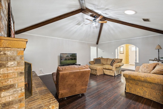 7108 Stonybrooke Dr, North Richland Hills, TX 76182 - living area featuring arched walkways, beam ceiling, a ceiling fan, a brick fireplace, and dark wood-type flooring