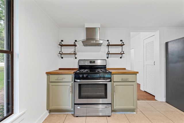 306 N Bordon St, Lorena, TX 76655 - kitchen with stainless steel range with gas cooktop, range hood, butcher block counters, fridge, and ornamental molding