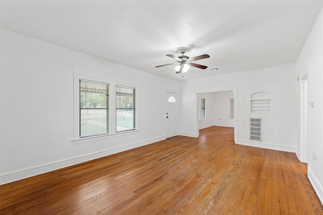 306 N Bordon St, Lorena, TX 76655 - unfurnished living room with ceiling fan, light wood-style floors, and baseboards