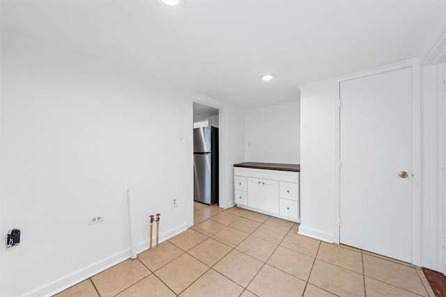 306 N Bordon St, Lorena, TX 76655 - spare room with light tile patterned flooring, baseboards, and recessed lighting