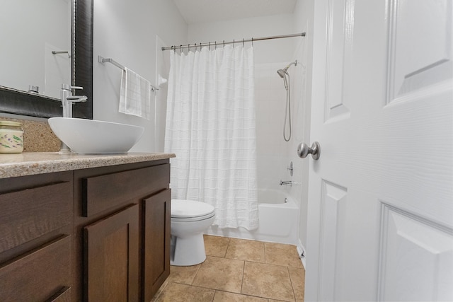 bathroom featuring vanity, toilet, shower / tub combo, and tile patterned flooring
