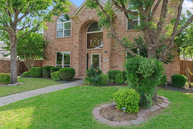 traditional home featuring brick siding