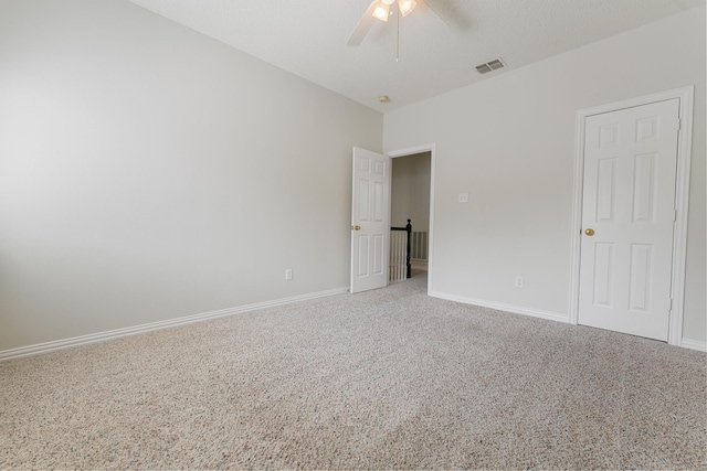 unfurnished bedroom with carpet flooring, baseboards, and a ceiling fan