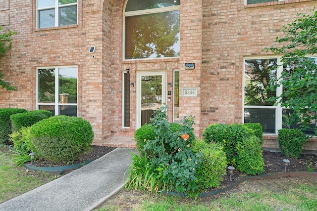 entrance to property with brick siding
