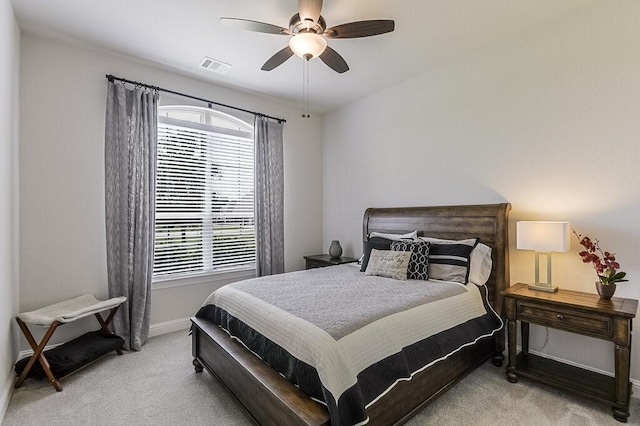 2720 Creek Crossing Ln, Midlothian, TX 76065 - bedroom featuring light colored carpet, multiple windows, baseboards, and a ceiling fan