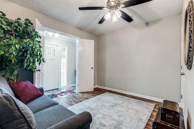 2614 Ivandell Ave, Dallas, TX 75211 - living area with baseboards, wood finished floors, a textured ceiling, and ceiling fan