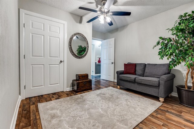 2614 Ivandell Ave, Dallas, TX 75211 - living area featuring ceiling fan, wood finished floors, a textured ceiling, and baseboards